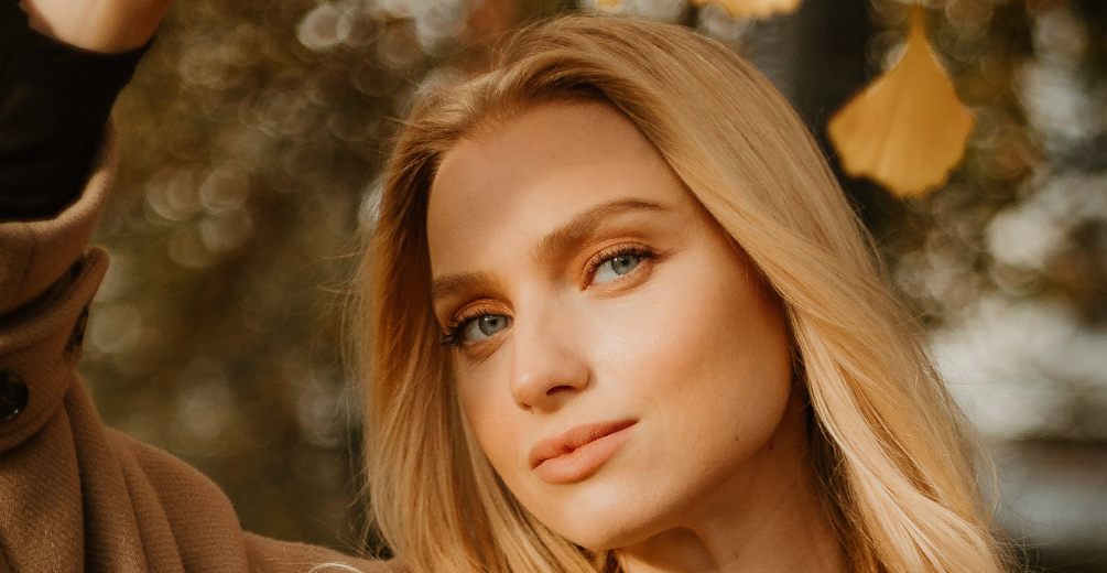 Fall Hair Care Tips by Shear Excellence Woman with beautiful hair during the fall by Shear Excellence Rantoul IL