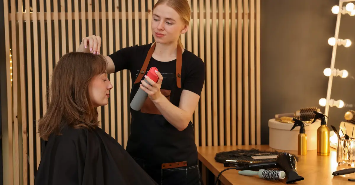 Service Provider consulting with a client about choosing the right hairstyle based on hair texture and volume at Shear Excellence in Rantoul, IL.