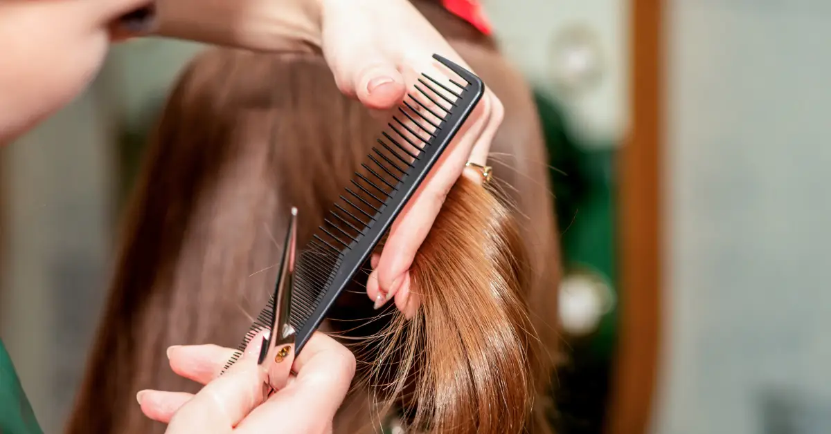 Service Provider performing a precision haircut and professional hair services at Shear Excellence in Rantoul, IL.